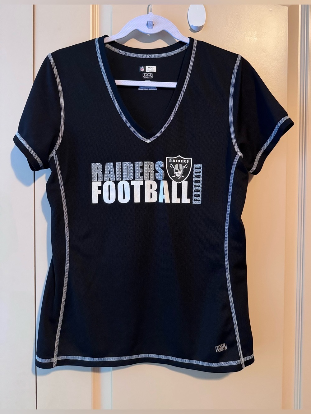 Raiders NFL Team Apparel Women's V-Neck T-Shirt.